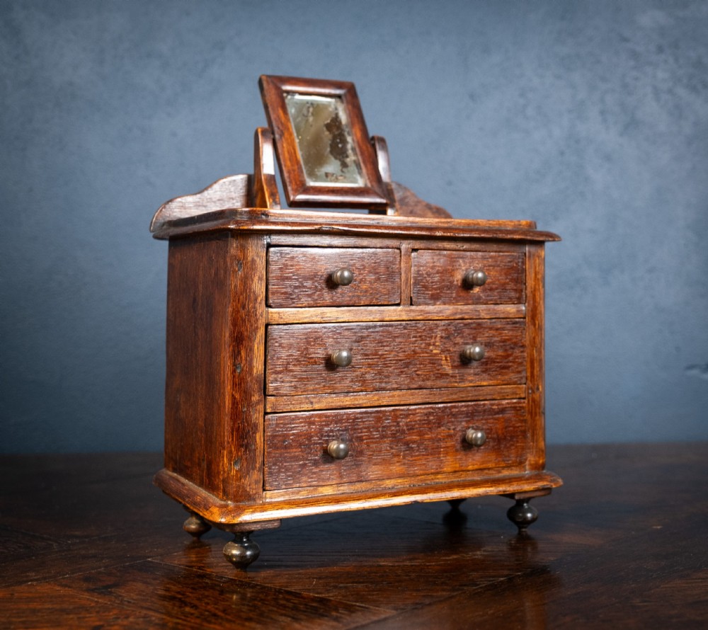 Miniature Early 19th Century Oak Chest Of Drawers With Swing Mirror View III