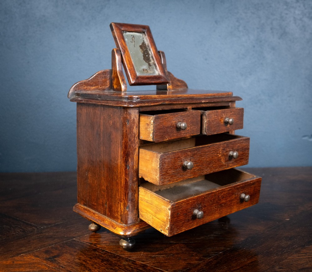 Miniature Early 19th Century Oak Chest Of Drawers With Swing Mirror View V
