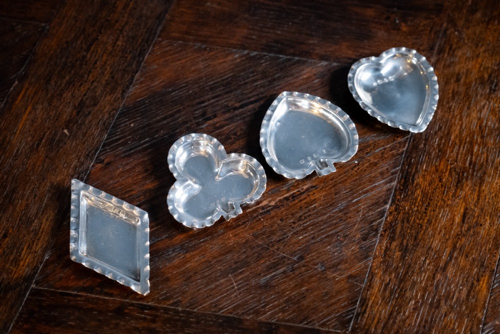 Four Silver Playing Card Suit Dishes by A & J Zimmerman, 1898.