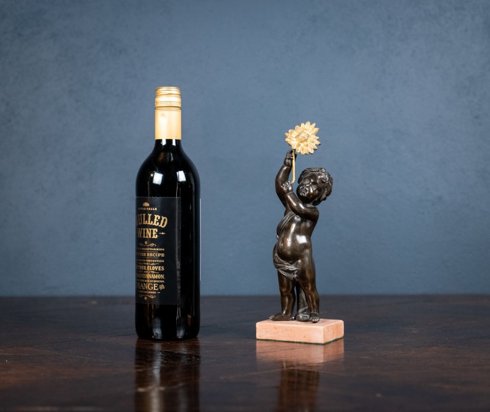 19th Century Bronze Putto Holding A Flower View XI