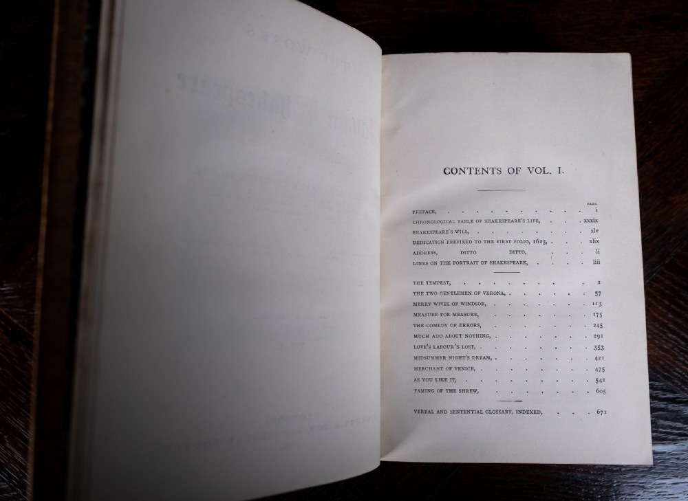 A four-volume set of 1881 Shakespeare leather-bound books standing upright, featuring heavily gilt-tooled spines with red and black title labels. View XV