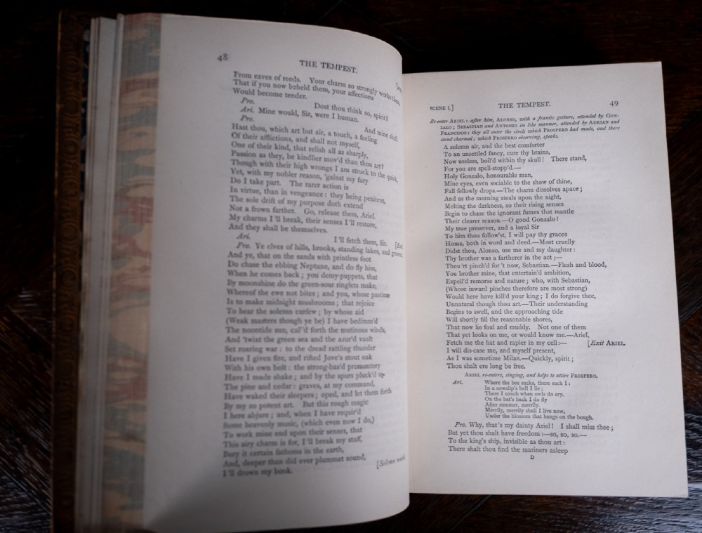 A four-volume set of 1881 Shakespeare leather-bound books standing upright, featuring heavily gilt-tooled spines with red and black title labels. View XVI