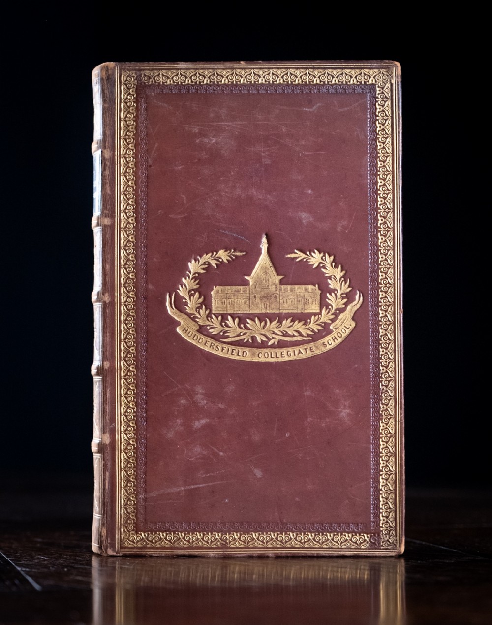 A 1850 Victorian leather-bound book featuring gold gilt floral tooling on the spine and a black title label. View II