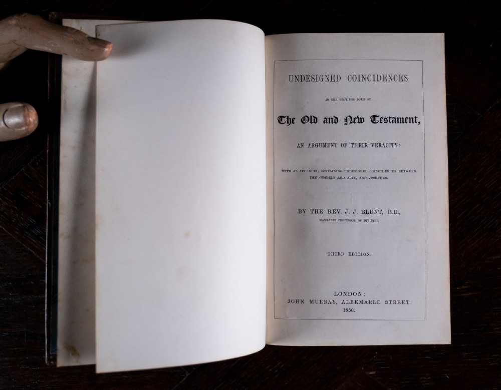 A 1850 Victorian leather-bound book featuring gold gilt floral tooling on the spine and a black title label. View VIII