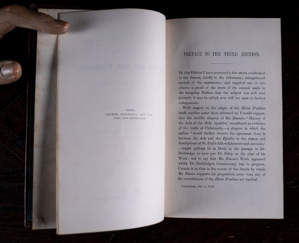 A 1850 Victorian leather-bound book featuring gold gilt floral tooling on the spine and a black title label. View IX