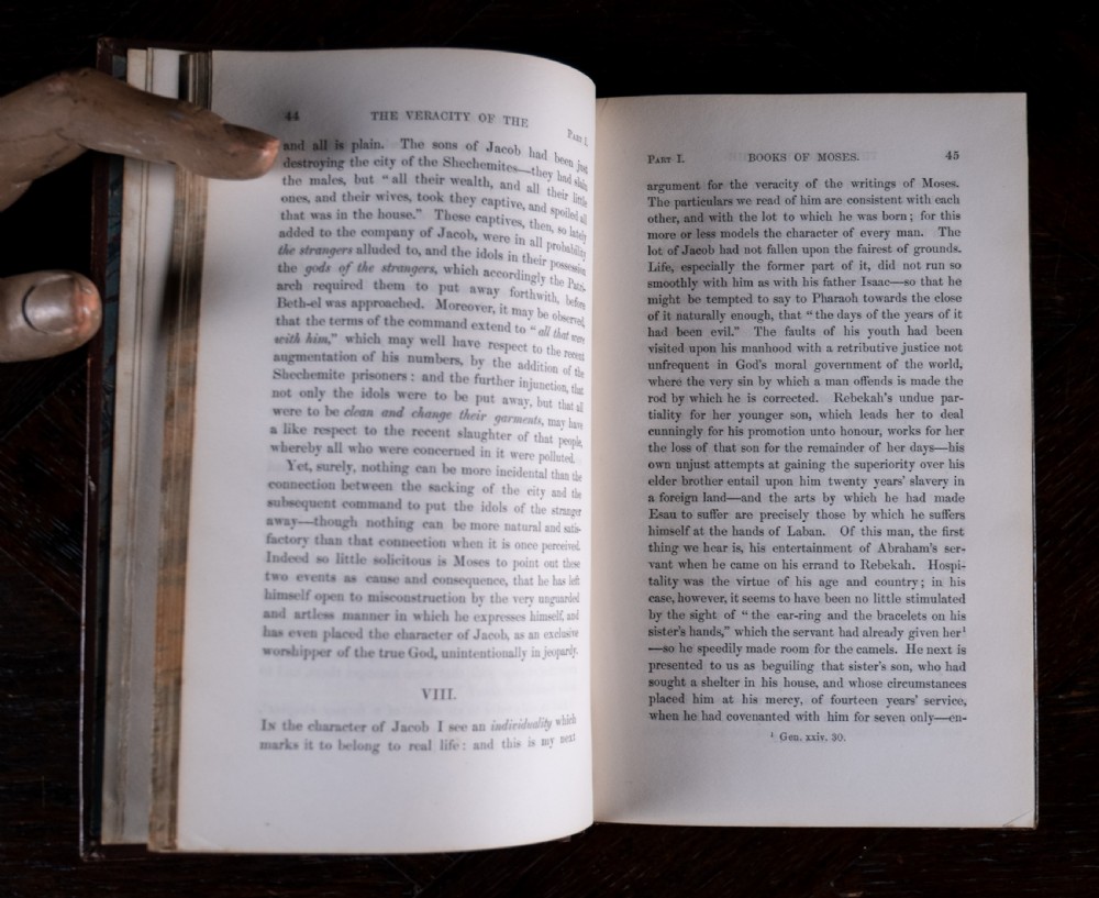 A 1850 Victorian leather-bound book featuring gold gilt floral tooling on the spine and a black title label. View X