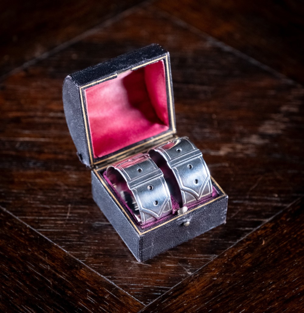 Cased Pair Silver Belt Buckle Napkin Rings by James Dixon & Sons, 1894.