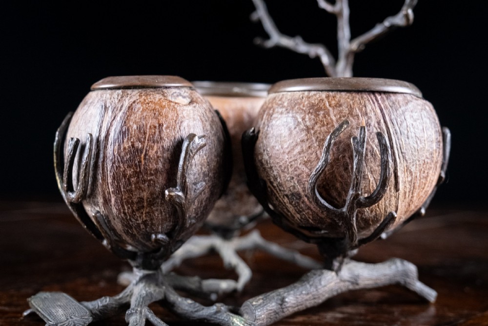 A Victorian bronze and coconut shell table vesta featuring three carved coconut vessels supported by cast metal branch mounts. View III