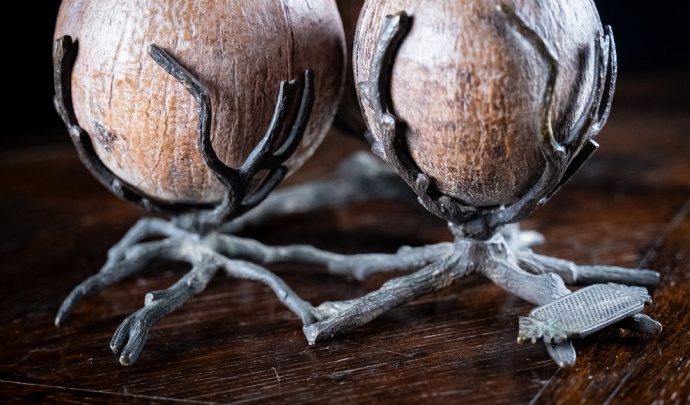 A Victorian bronze and coconut shell table vesta featuring three carved coconut vessels supported by cast metal branch mounts. View V
