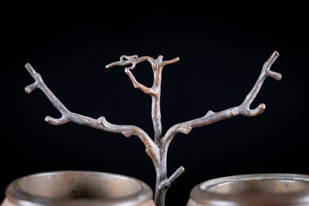 A Victorian bronze and coconut shell table vesta featuring three carved coconut vessels supported by cast metal branch mounts. View VI