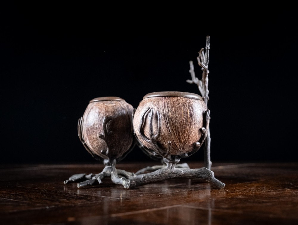 A Victorian bronze and coconut shell table vesta featuring three carved coconut vessels supported by cast metal branch mounts. View IX
