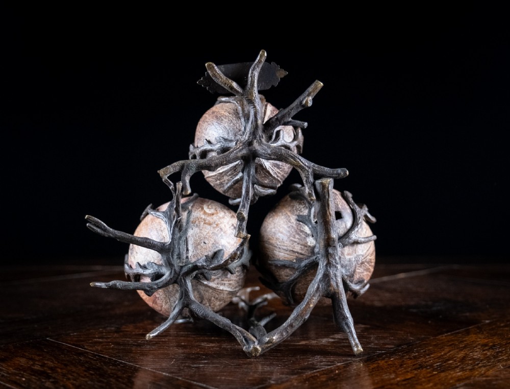 A Victorian bronze and coconut shell table vesta featuring three carved coconut vessels supported by cast metal branch mounts. View XIII