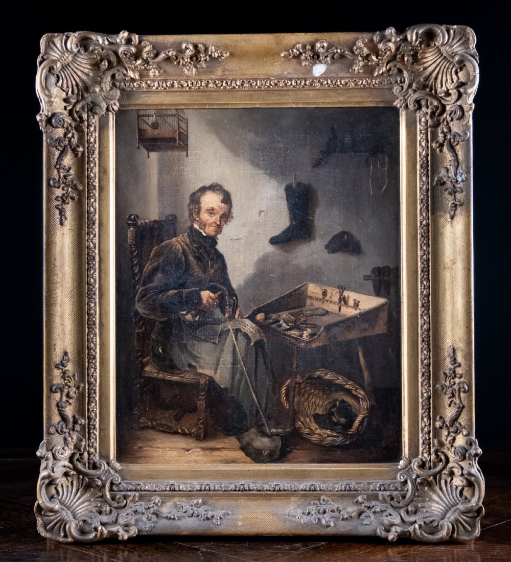 A 19th-century oil painting depicting a seated cobbler working at a bench, encased within an ornate gilded frame with shell corner detailing.