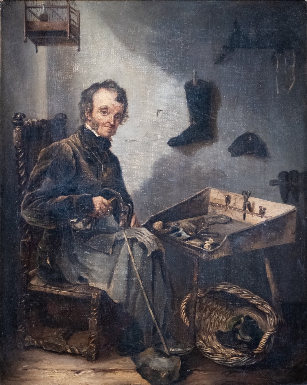 A 19th-century oil painting depicting a seated cobbler working at a bench, encased within an ornate gilded frame with shell corner detailing. View II