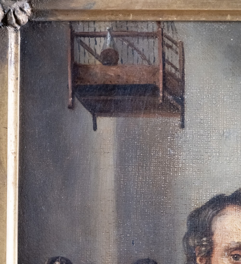 A 19th-century oil painting depicting a seated cobbler working at a bench, encased within an ornate gilded frame with shell corner detailing. View VII