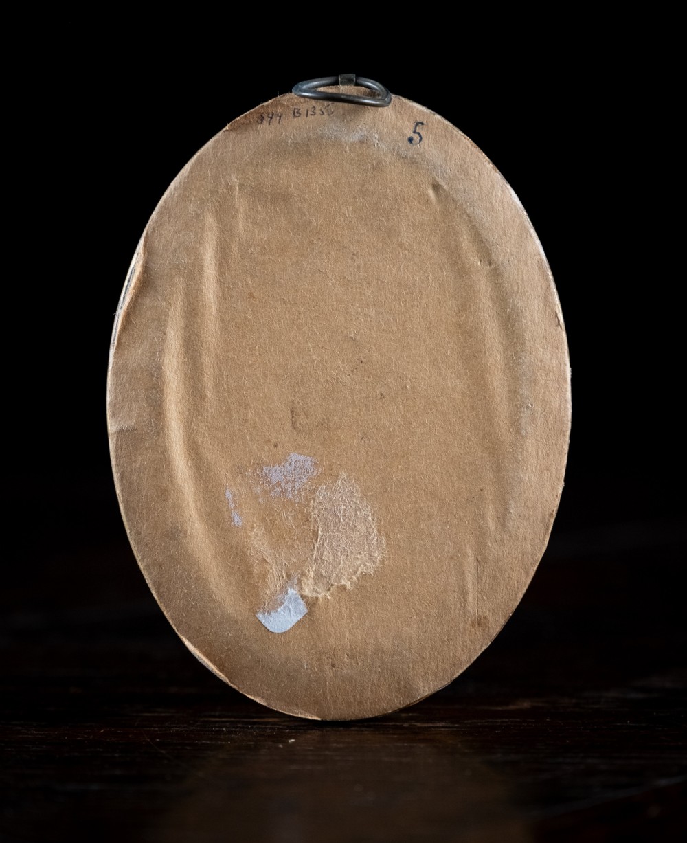 An oval early nineteenth-century silhouette portrait of a lady shown in profile with gold detailing, housed in a beaded gilded frame. View VIII