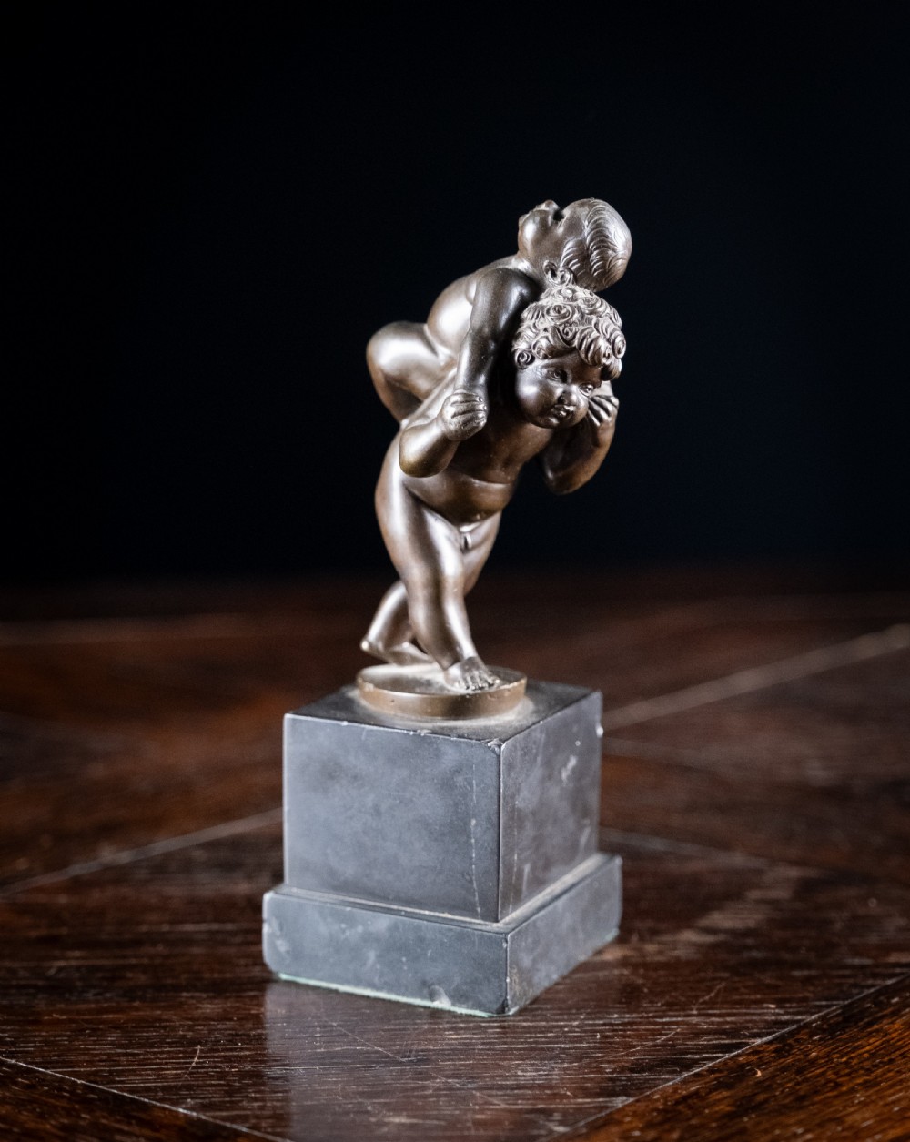 Bronze Putti Playing Piggyback After Leonhard Kern (1588-1662)