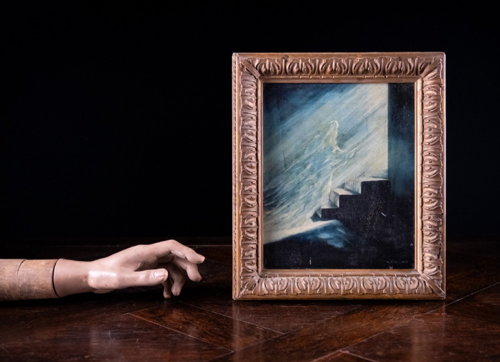 An 1880 oil painting depicting a luminous figure ascending steps towards light, set inside a heavy carved giltwood frame. View VI