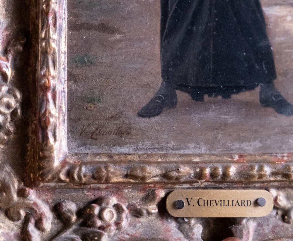 A 19th-century oil painting on panel depicting a smiling clergyman reading a book, set within a heavily carved rococo gilt frame. View V