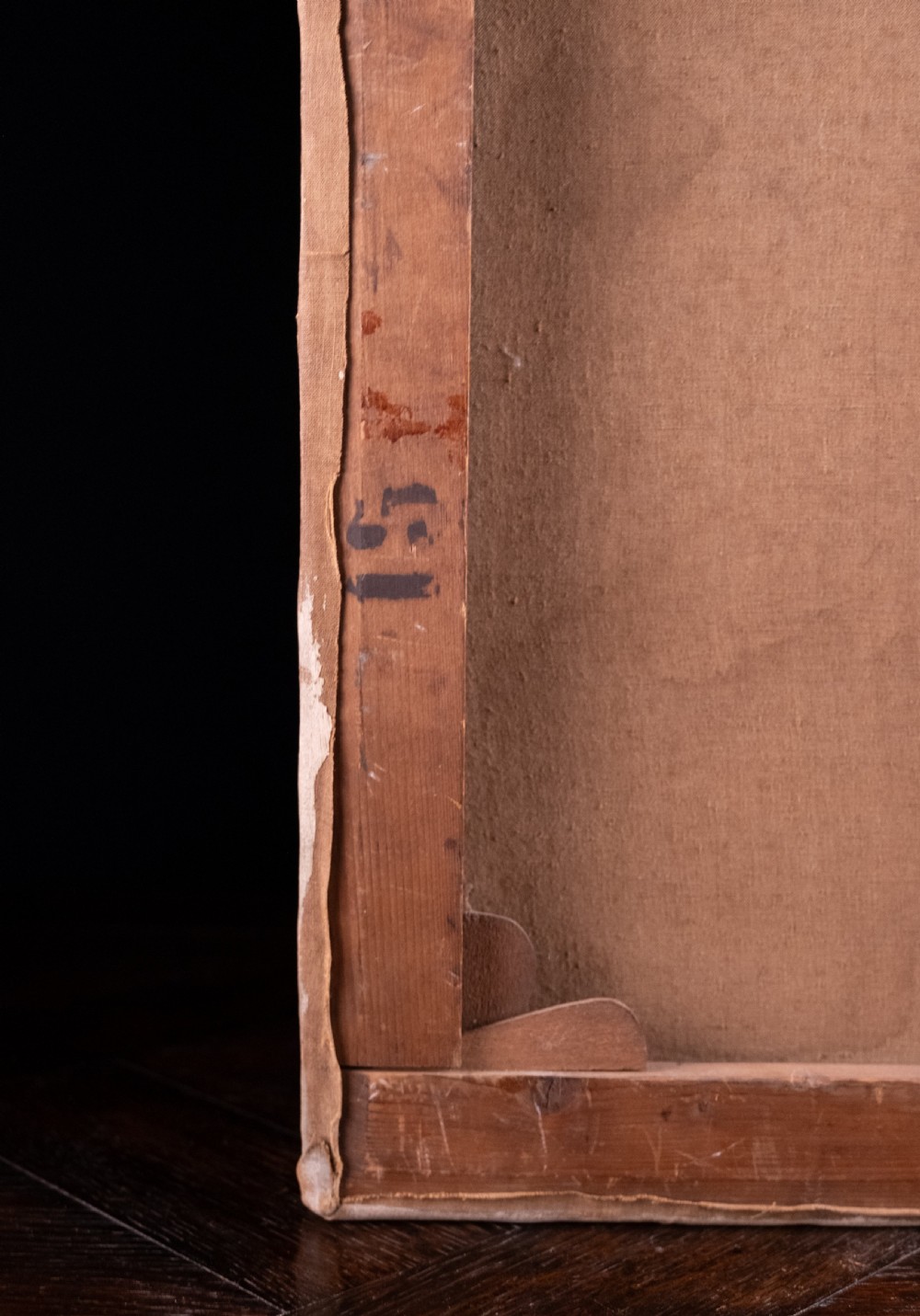 An oil painting depicting a human skull resting on a bound book alongside an artist palette, brushes, and a pinned sketch against a vertical timber panel background. View XIII