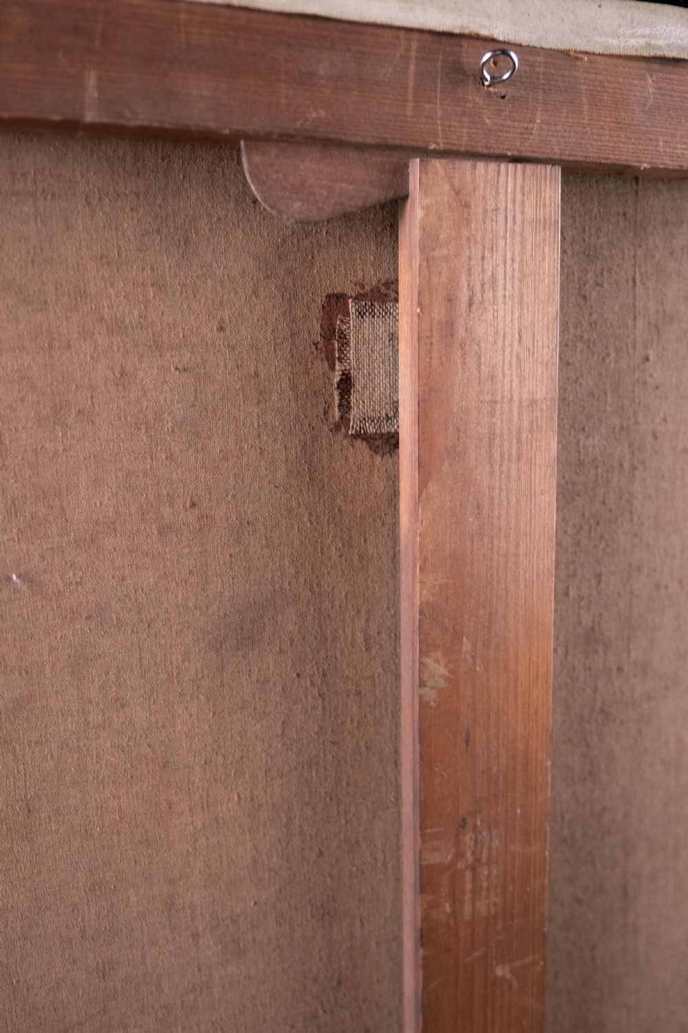 An oil painting depicting a human skull resting on a bound book alongside an artist palette, brushes, and a pinned sketch against a vertical timber panel background. View XIV