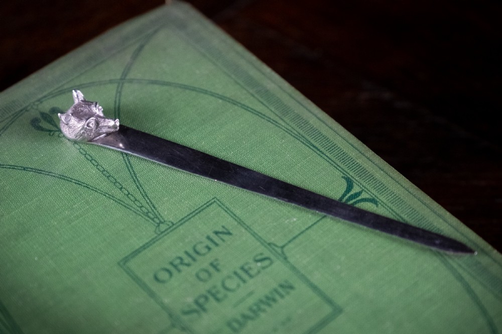 A solid sterling silver letter opener featuring a cast fox head terminal and a tapered flat blade. View II