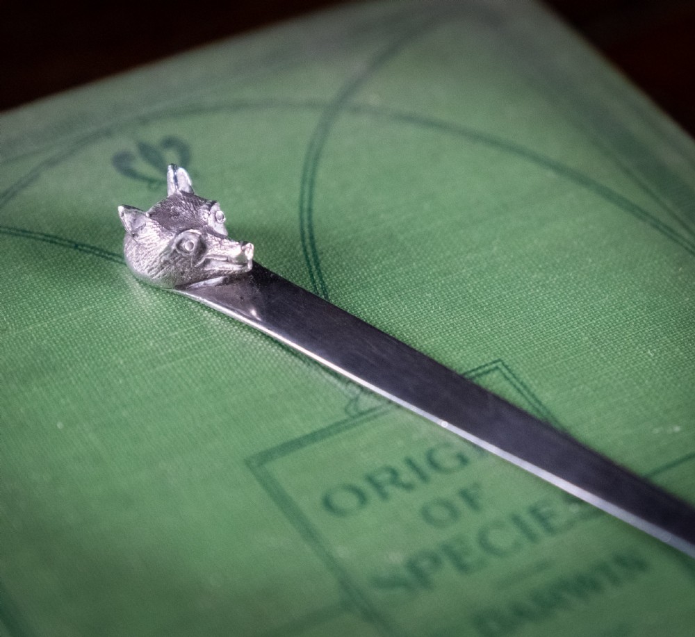 A solid sterling silver letter opener featuring a cast fox head terminal and a tapered flat blade. View III