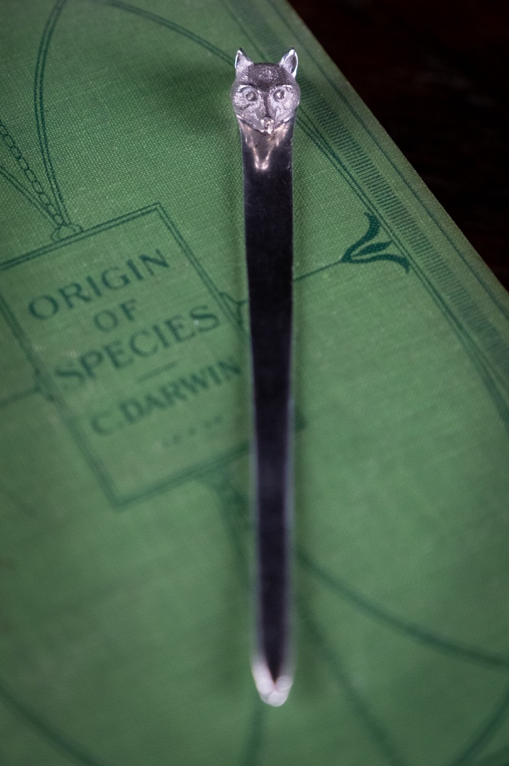 A solid sterling silver letter opener featuring a cast fox head terminal and a tapered flat blade. View IV