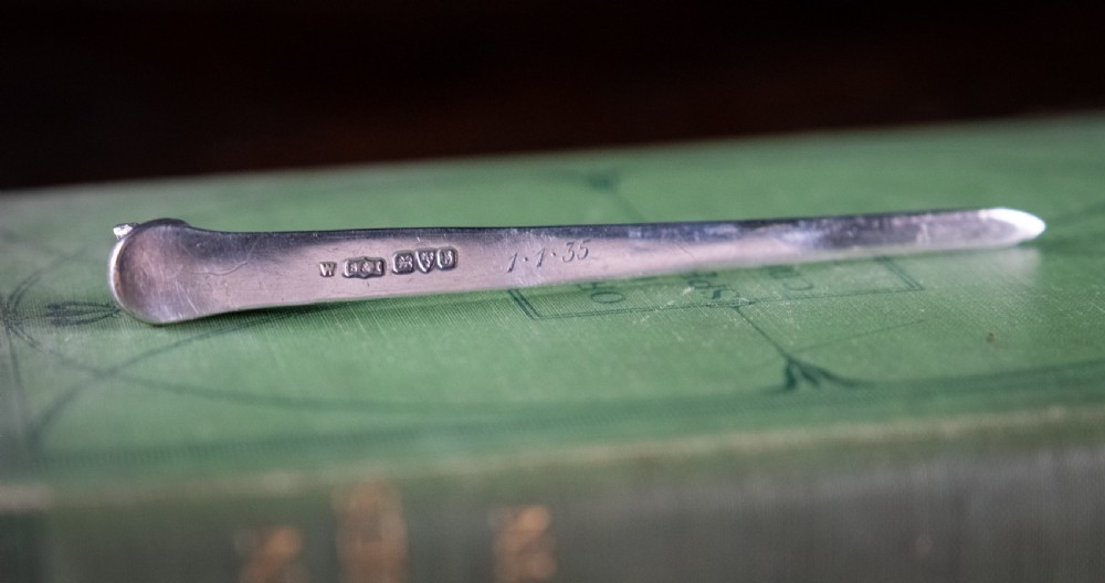 A solid sterling silver letter opener featuring a cast fox head terminal and a tapered flat blade. View V