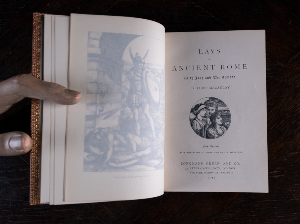 A red leather-bound edition of Lays of Ancient Rome by Macaulay, featuring raised spine bands and gilt lettering. View X