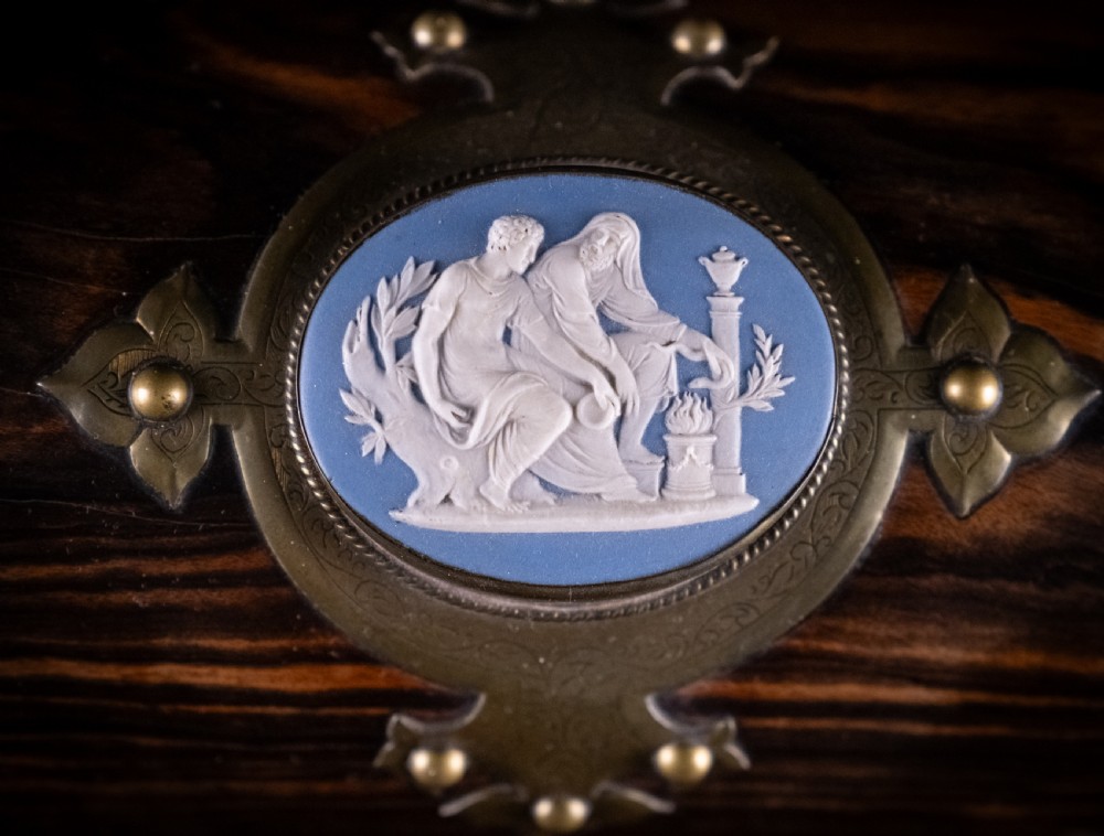 A Victorian domed coromandel wood casket featuring a central blue jasperware cameo medallion set within engraved brass mounts and a twisted brass border. View III