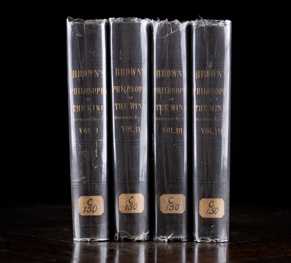 A complete four-volume set of 1846 antique books titled Browns Philosophy of the Mind with gilt lettering on dark grey spines. View IV