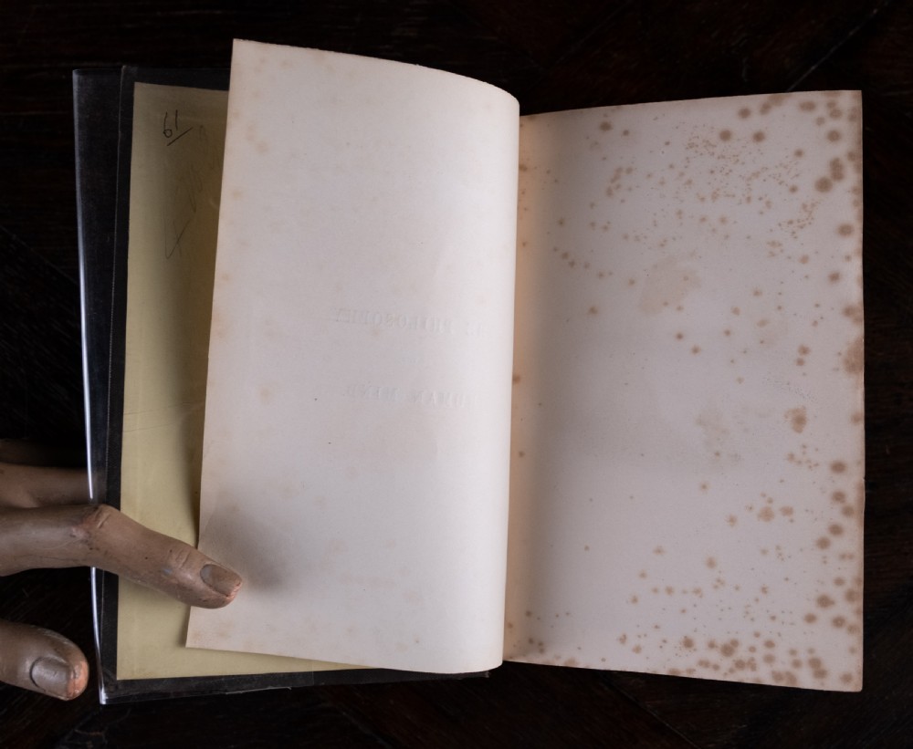 A complete four-volume set of 1846 antique books titled Browns Philosophy of the Mind with gilt lettering on dark grey spines. View V