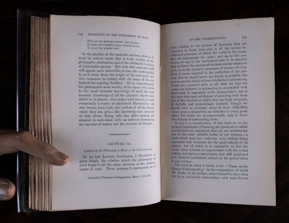 A complete four-volume set of 1846 antique books titled Browns Philosophy of the Mind with gilt lettering on dark grey spines. View XII