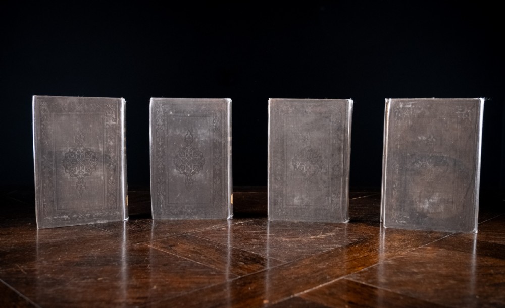 A complete four-volume set of 1846 antique books titled Browns Philosophy of the Mind with gilt lettering on dark grey spines. View XVIII