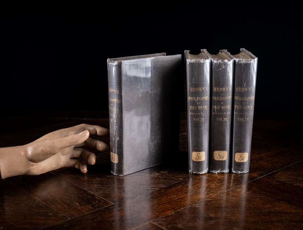 A complete four-volume set of 1846 antique books titled Browns Philosophy of the Mind with gilt lettering on dark grey spines. View XIX