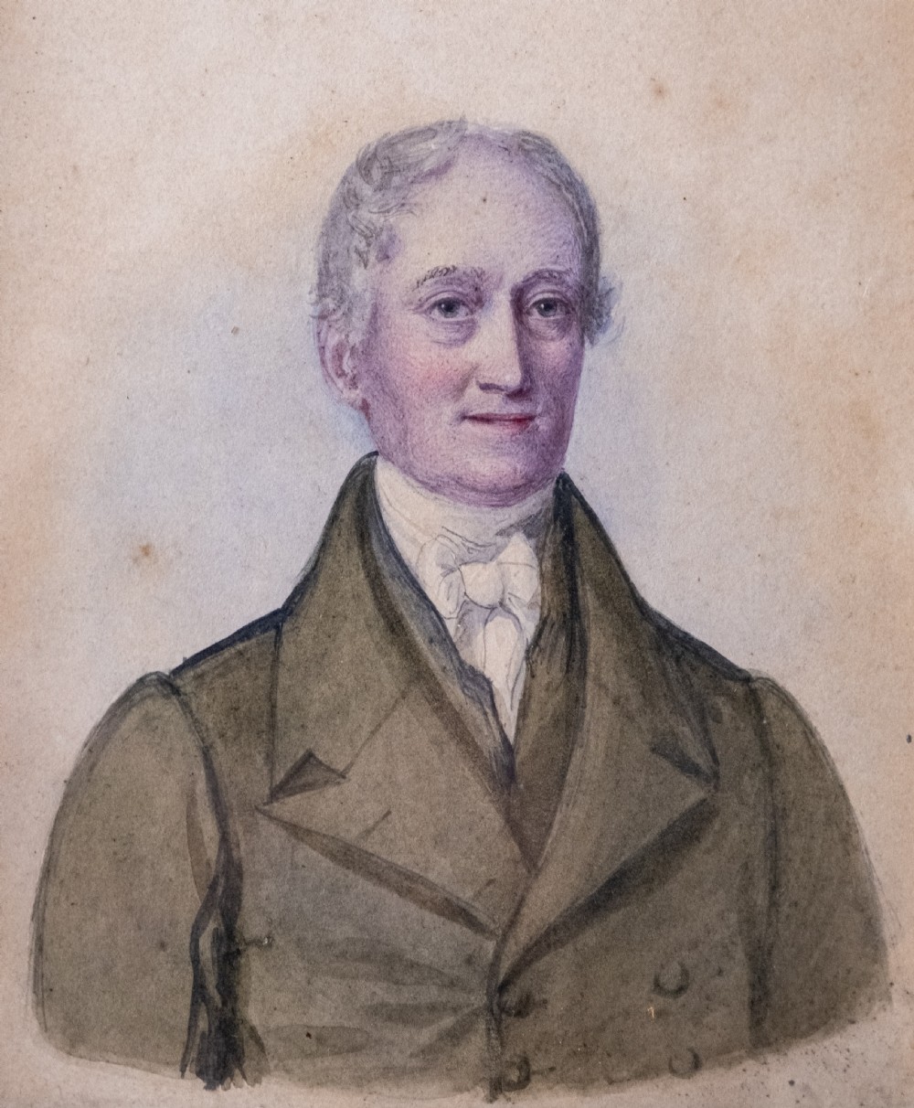 A pair of early 19th-century watercolour portrait paintings featuring a gentleman and a lady set within thick moulded giltwood frames. View VII