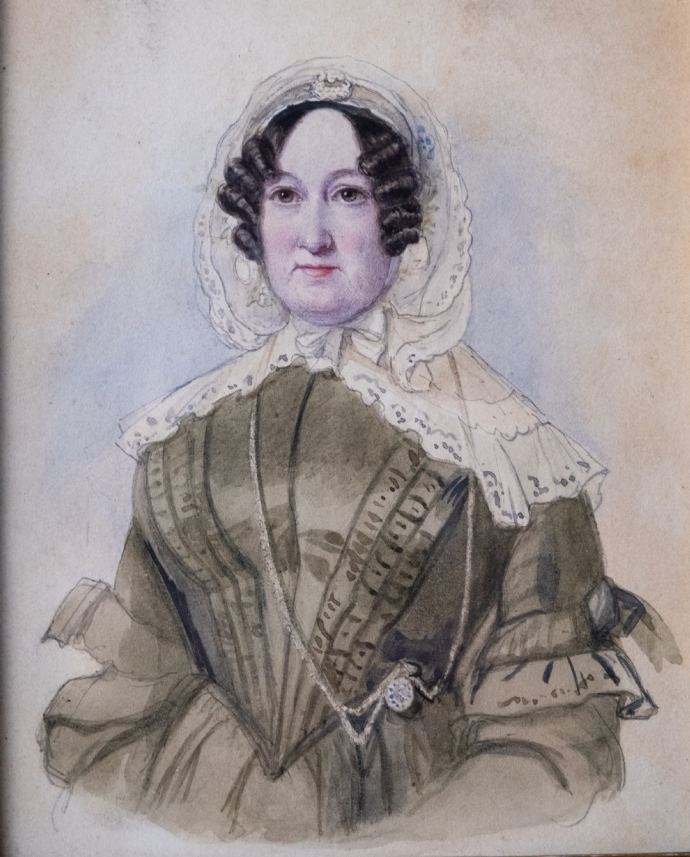 A pair of early 19th-century watercolour portrait paintings featuring a gentleman and a lady set within thick moulded giltwood frames. View VIII