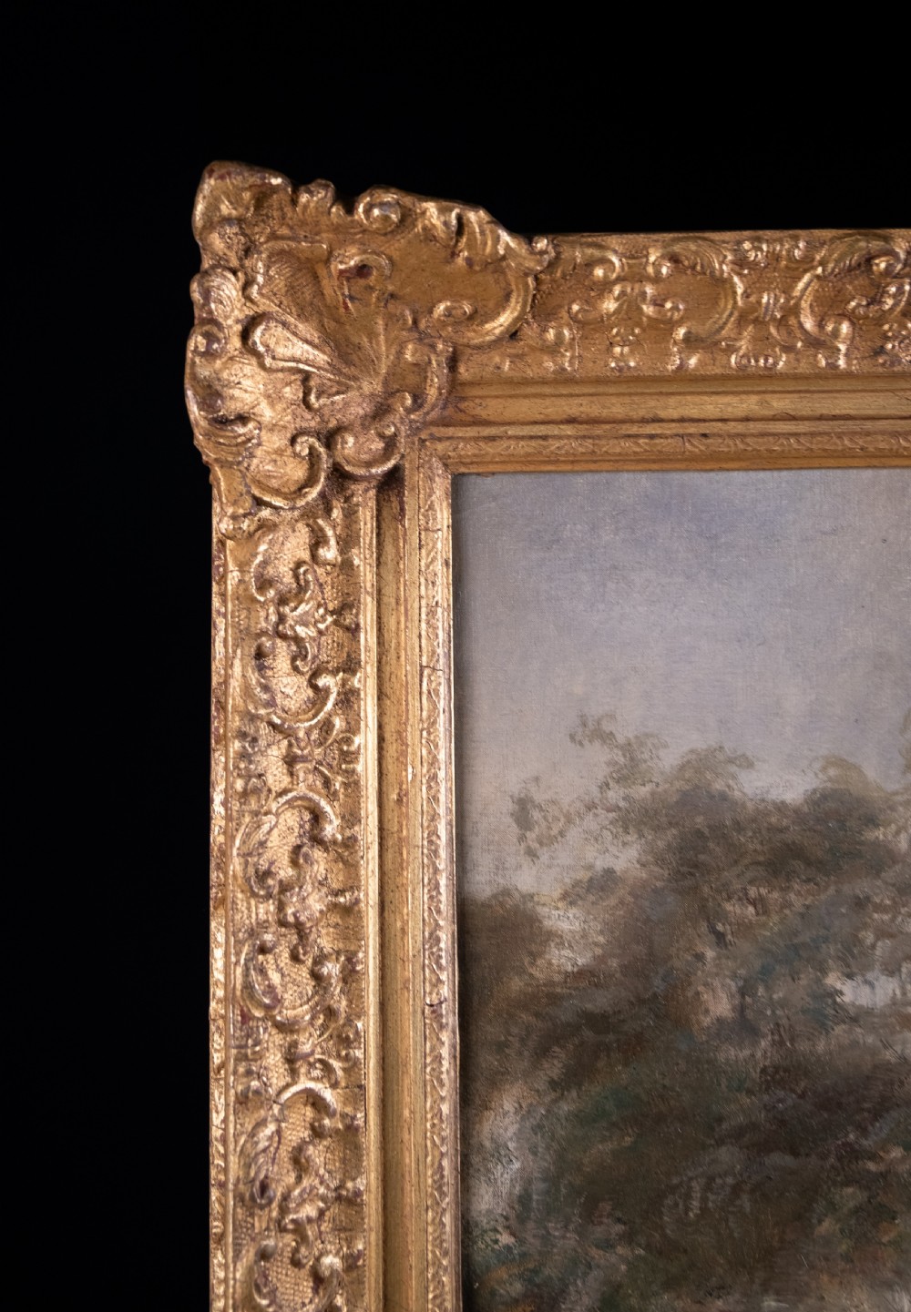 An impressionist oil painting depicting a rural countryside landscape with a large tree by a river, enclosed within an ornate gilded frame. View XIII