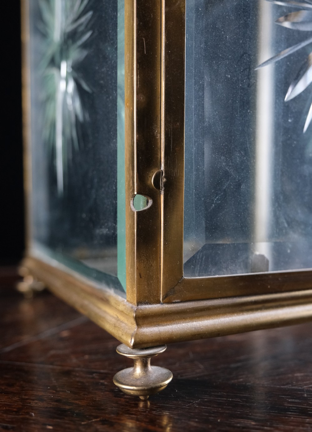 An Edwardian brass square-framed hall lantern featuring bevelled glass panels with starburst cuts and scrollwork hanging arms. View XI