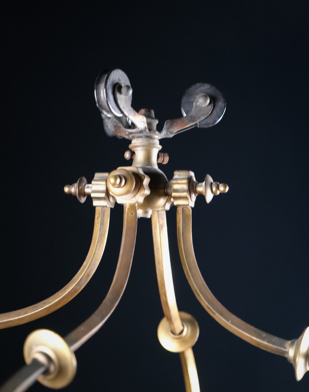 An Edwardian brass square-framed hall lantern featuring bevelled glass panels with starburst cuts and scrollwork hanging arms. View XIII