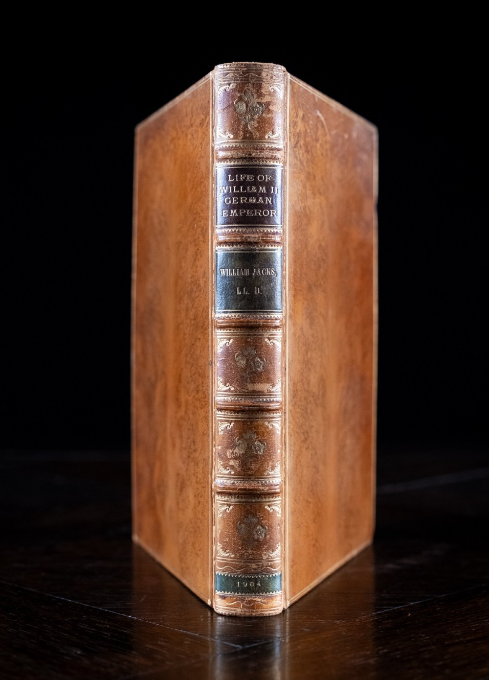 A 1904 leather-bound book titled Life of William the Second German Emperor standing vertically with gilt detailing on the spine.