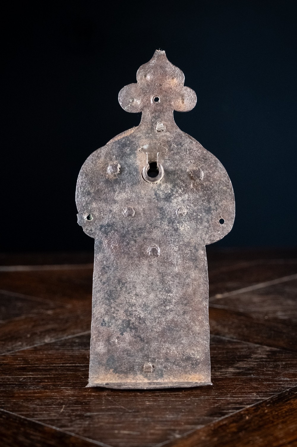 A hand-forged sixteenth-century wrought iron lock plate with a prominent key barrel and trefoil top finial. View III