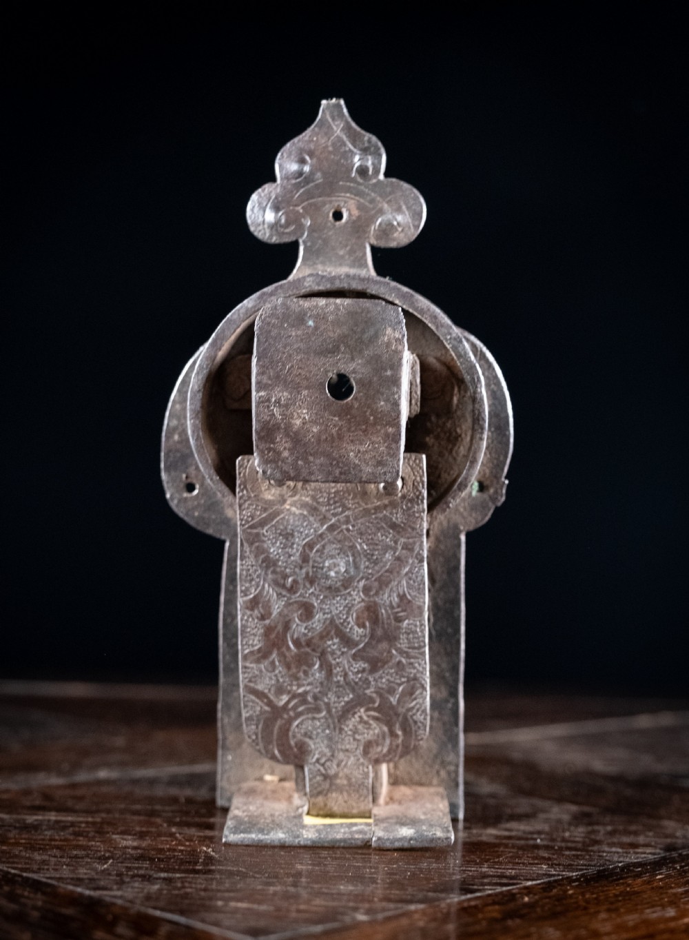 A hand-forged sixteenth-century wrought iron lock plate with a prominent key barrel and trefoil top finial. View VII