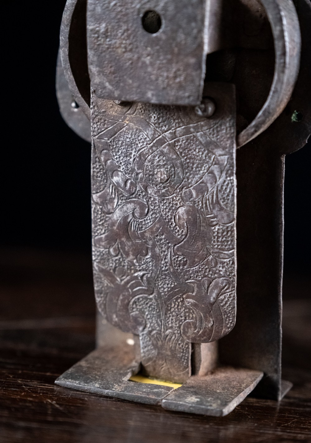 A hand-forged sixteenth-century wrought iron lock plate with a prominent key barrel and trefoil top finial. View VIII