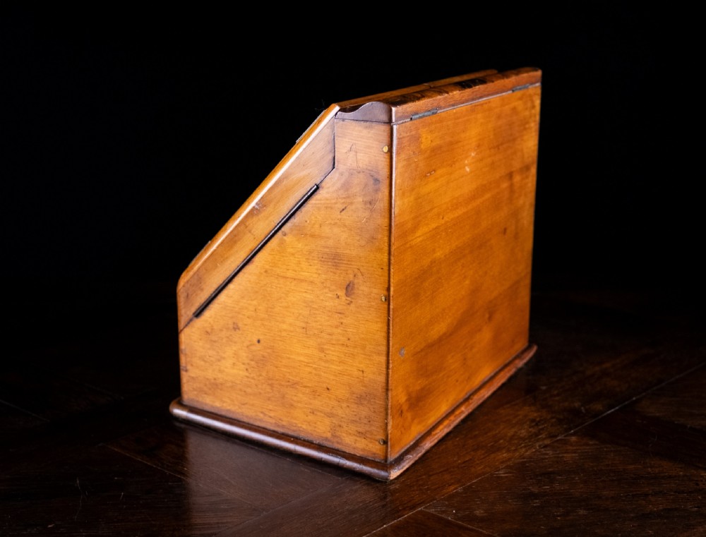 A late nineteenth-century Victorian walnut slope-front stationery cabinet featuring ornate brass strapwork mounts and lock escutcheons. View XI