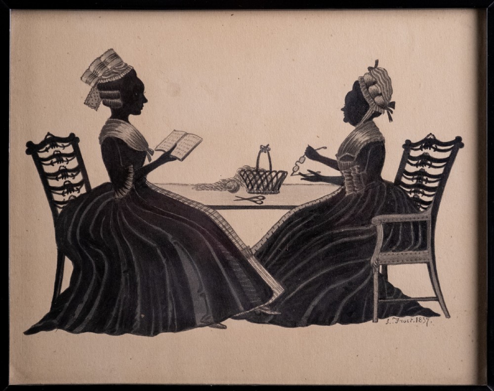 A framed 1837 silhouette artwork featuring two seated ladies in profile facing each other at a table, mounted within a wide black wooden frame. View II