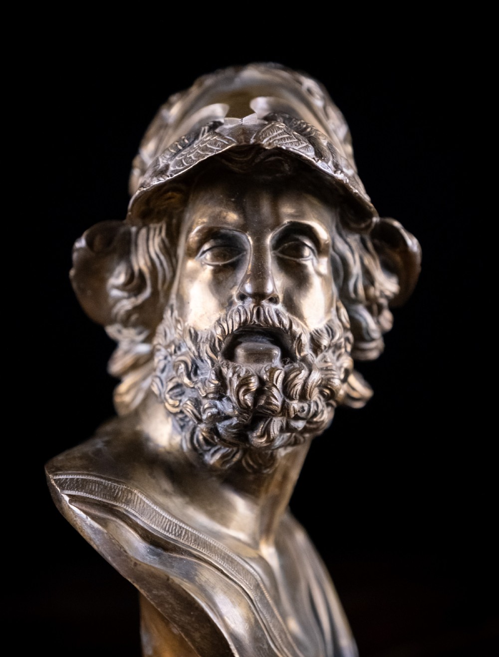 A nineteenth-century gilt bronze sculptural bust depicting the classical hero Ajax in profile, wearing an ornate helmet and mounted on a turned pedestal base. View V
