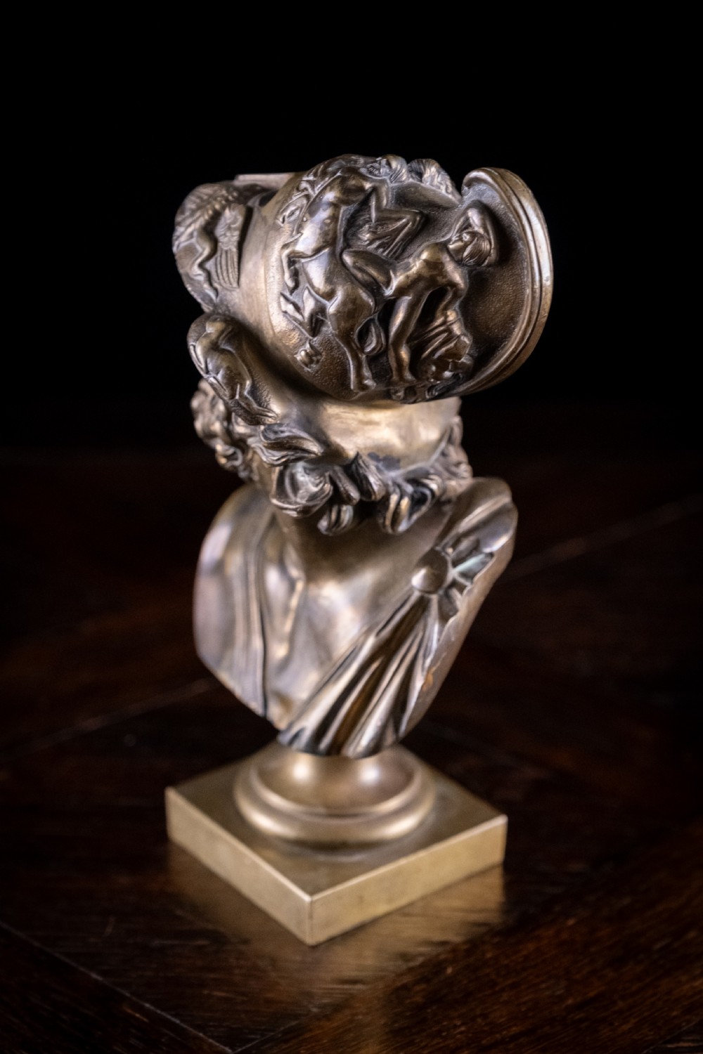 A nineteenth-century gilt bronze sculptural bust depicting the classical hero Ajax in profile, wearing an ornate helmet and mounted on a turned pedestal base. View VI
