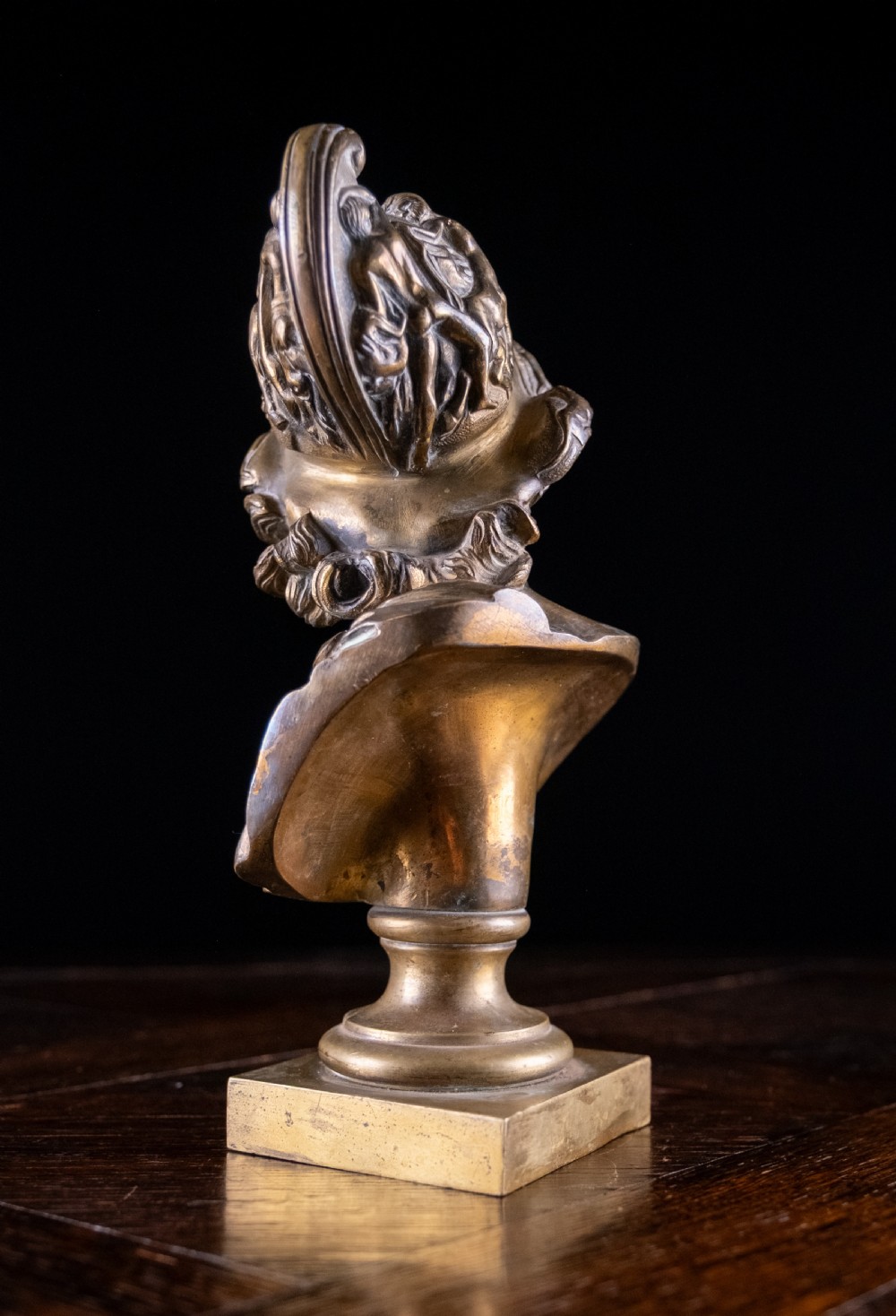 A nineteenth-century gilt bronze sculptural bust depicting the classical hero Ajax in profile, wearing an ornate helmet and mounted on a turned pedestal base. View VIII